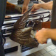 Illustration for article titled Mechanic saves adorable hawk jammed into Lexus grille